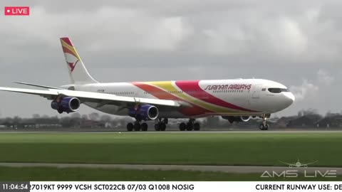 Landing of the Airbus A340-300 of Surinam Airways at Amsterdam Airport, Netherlands