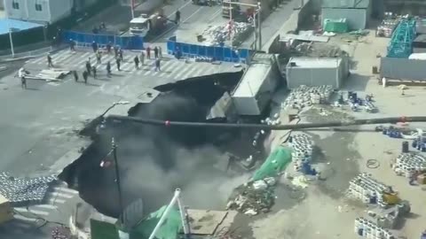 Massive sinkhole opens in Shanghai, China, swallowing a large section of roadway.