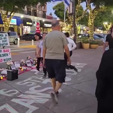 A man with an Israeli flag disrupted a vigil held to mourn the children of Gaza