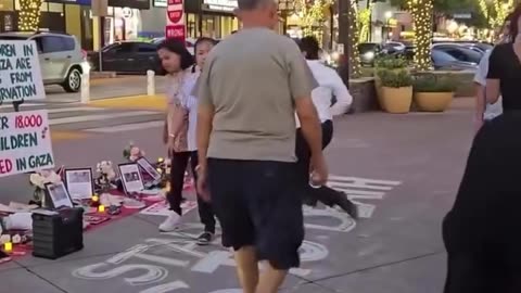 A man with an Israeli flag disrupted a vigil held to mourn the children of Gaza