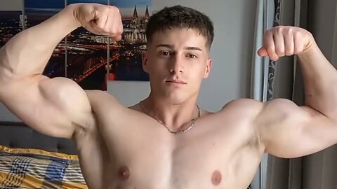 Young man flexing muscles