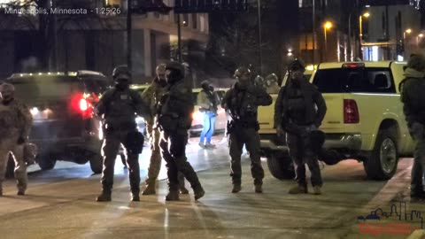 Federal Agencies Block Street At Hilton Hotel in Downtown Minneapolis, Minnesota