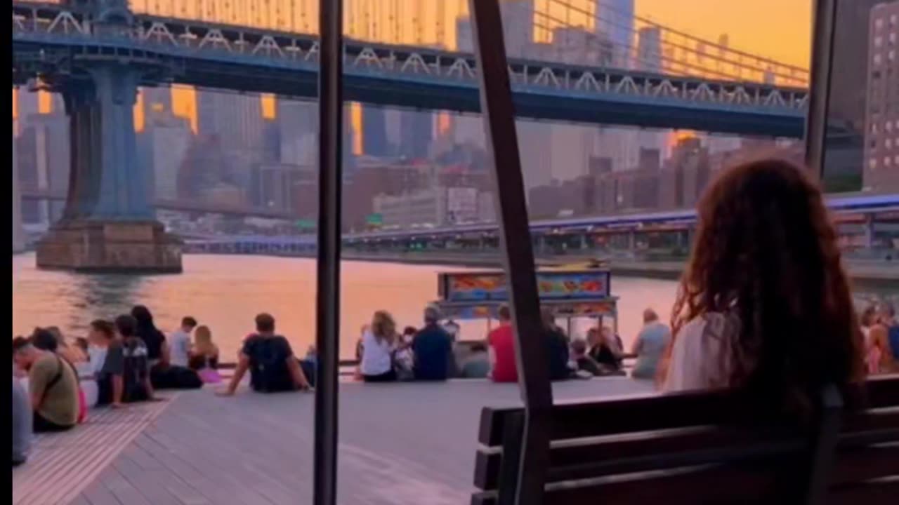 Motivation video with a lamp street, the rain & woman sit on a park