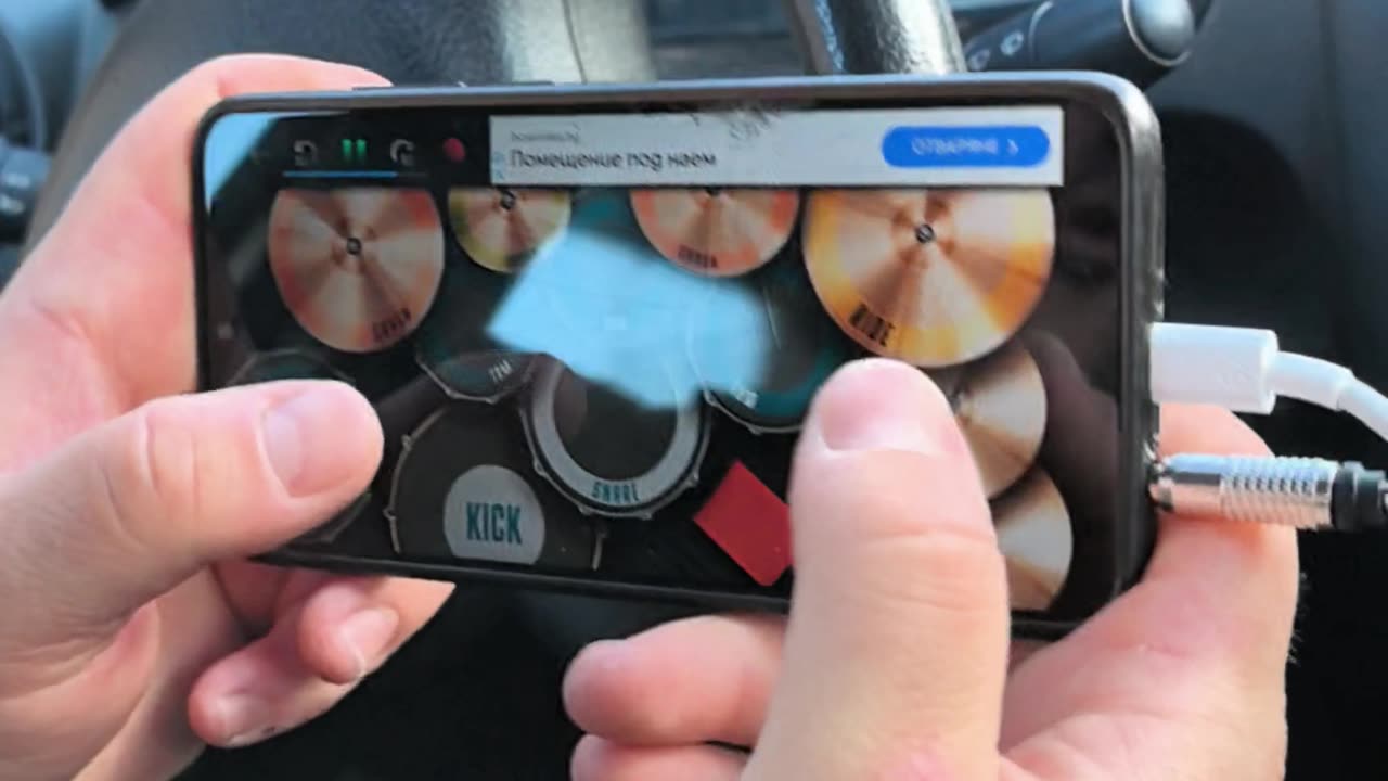 Talent plays drums with the app Real Drum