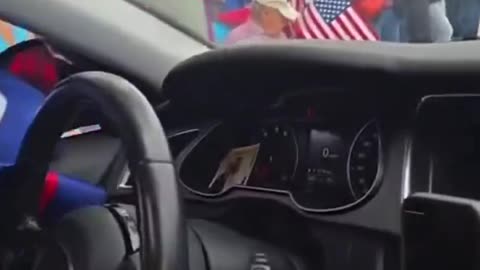 ‘No Kings’ protester tries to rip a Trump flag out of a man’s car.