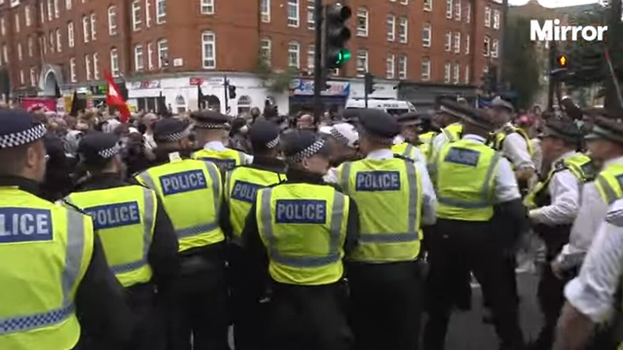 Protesters and police CLASH outside London hotel housing asylum seekers