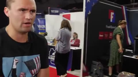 Charlie Kirk and his phone on Saturday