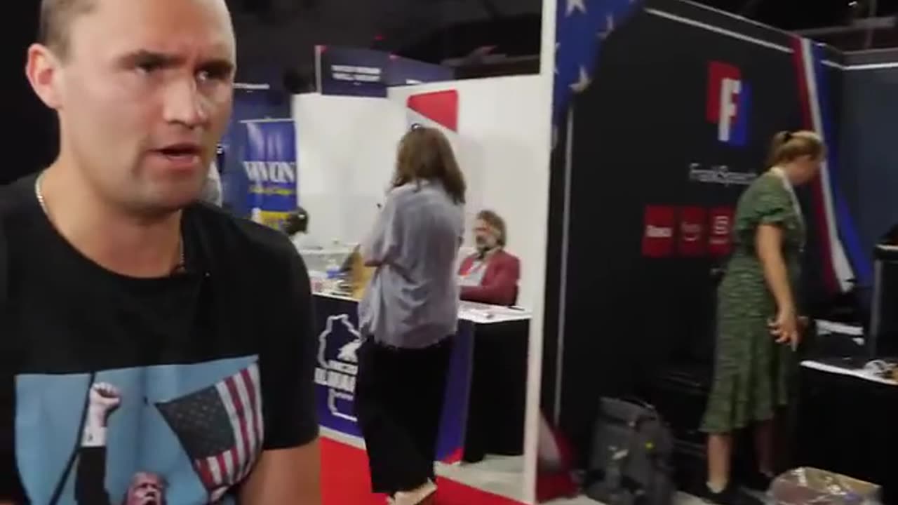 Charlie Kirk and his phone on Saturday