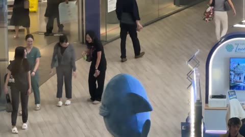 Shark Mascot Dances for Passers-By