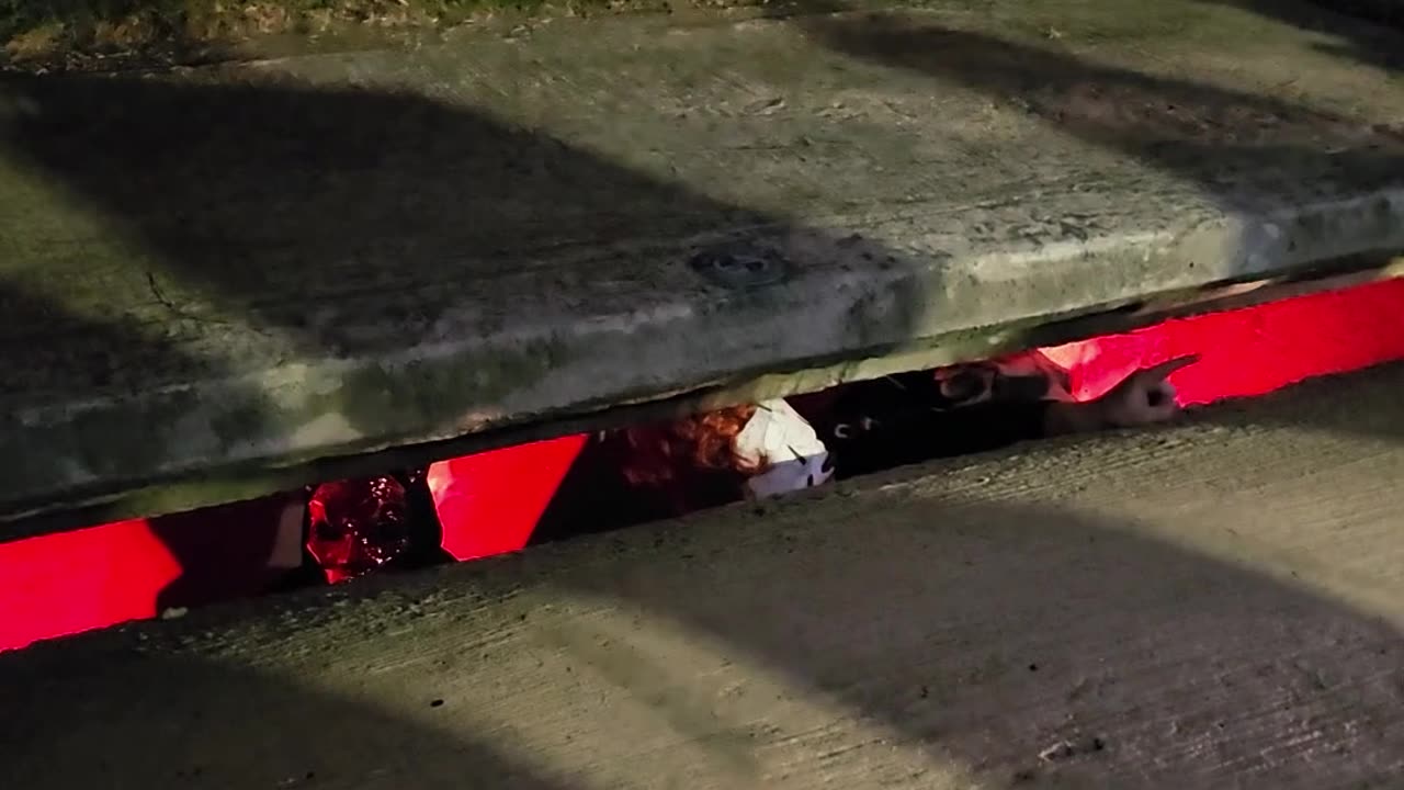 Pennywise Handing Out Candy From the Sewer