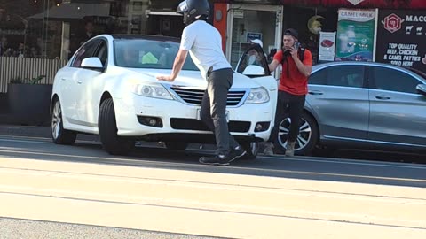 Motorcyclist Argues With Car Driver