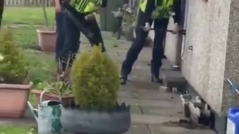 Police trying to break a door down
