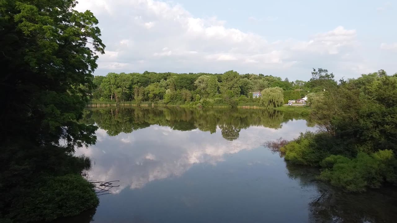 Neighborhood Pond at Sunset from a Drone