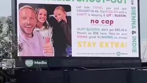 Father creates a billboard for his daughters.