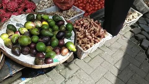 Shopping for Cassava and Fresh Fruits at the Traditional Market