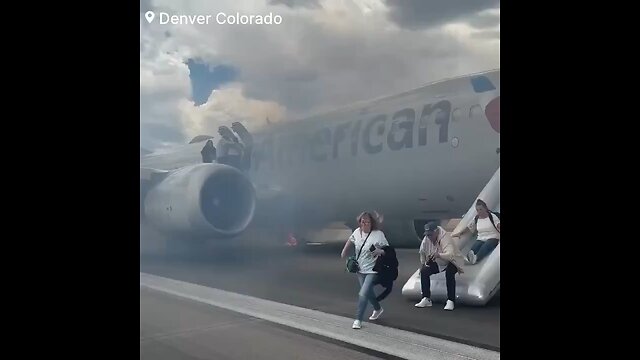 🚨: Watch as People evacuate from a American Airlines jet after a left main wheels caught fire