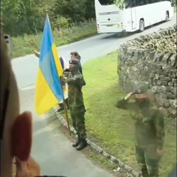 Ukrainian Soldiers Line The Streets and Salute Fallen Comrade and His Son