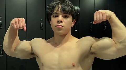 Handsome muscular man showing off his muscles
