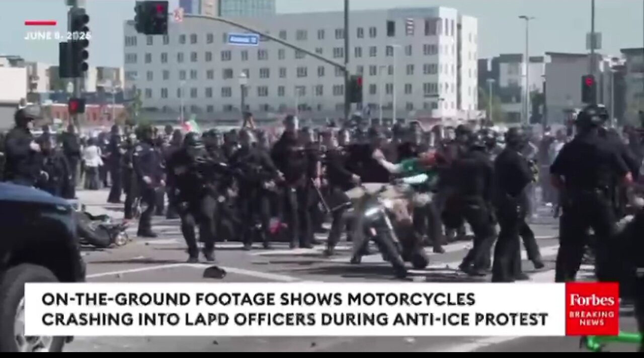 Motorcycle rider purposefully crashes into a police officer wall