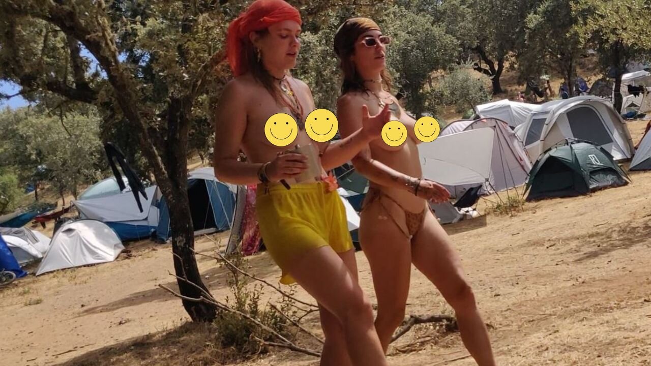 Topless hippie girls at festival
