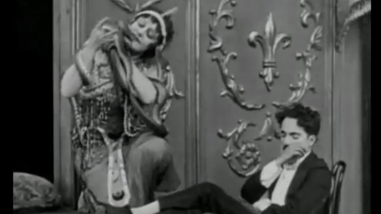 Charlie Chaplin's A Night In The Show (1915)