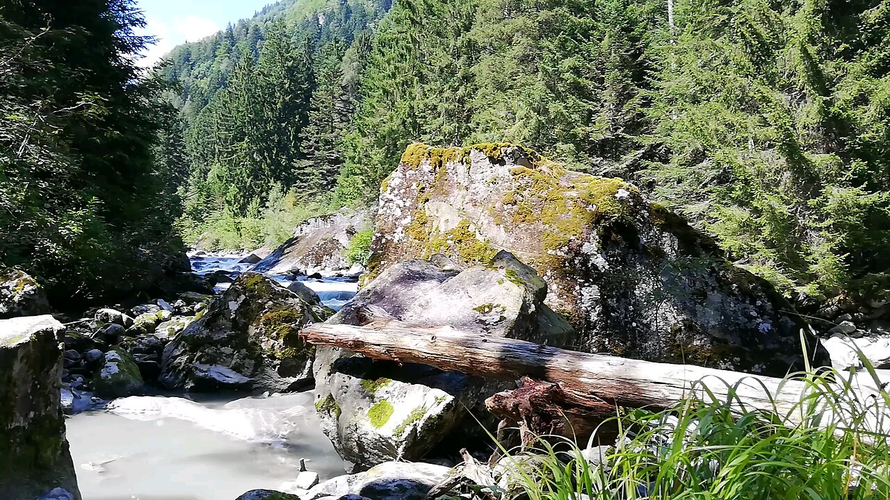 Rocky River At The Foot Of A Mountain