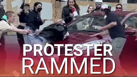 Protester run over by moving car as fed-up LA drivers have had enough of disruptive riots