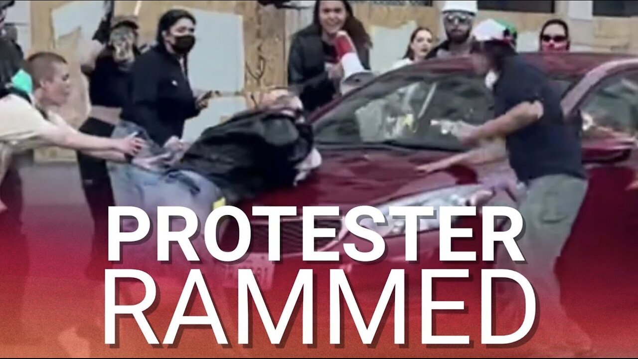 Protester run over by moving car as fed-up LA drivers have had enough of disruptive riots