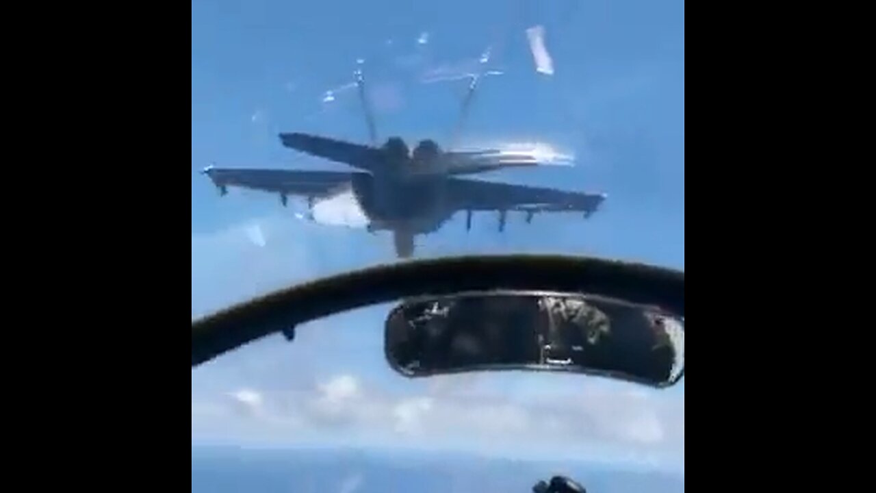 F/A-18 Hornet’s in formation flight with E-2 Hawkeye