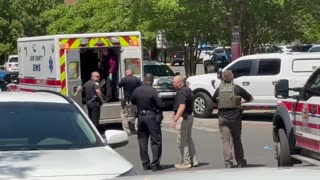 Suspect in custody! They bring in chains for him!
