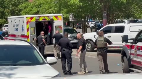 Suspect in custody! They bring in chains for him!