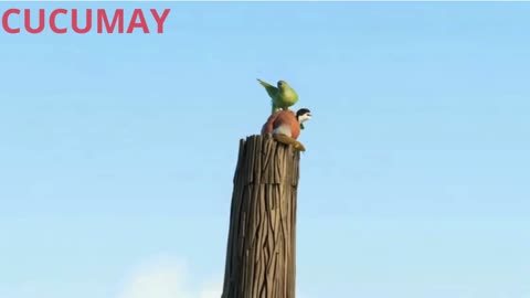 A small bird playing with its siblings on a felled tree