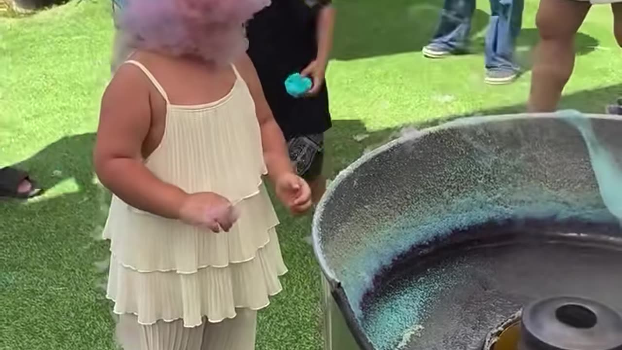 This girl is teaching us the right way how to eat cotton candy.