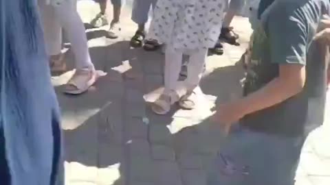 Woman without hijab attacked by Muslim mob.