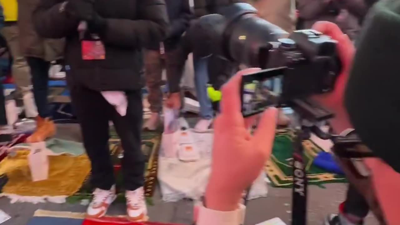 Thousands of Muslims gather for prayer in Times Square in New York City