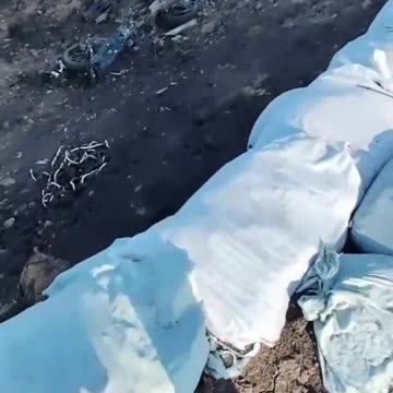 Russian Soldiers Walking Amongst Craters Full of Motorbikes