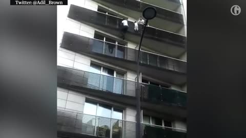 Paris hero climbs four-storey building to rescue dangling child