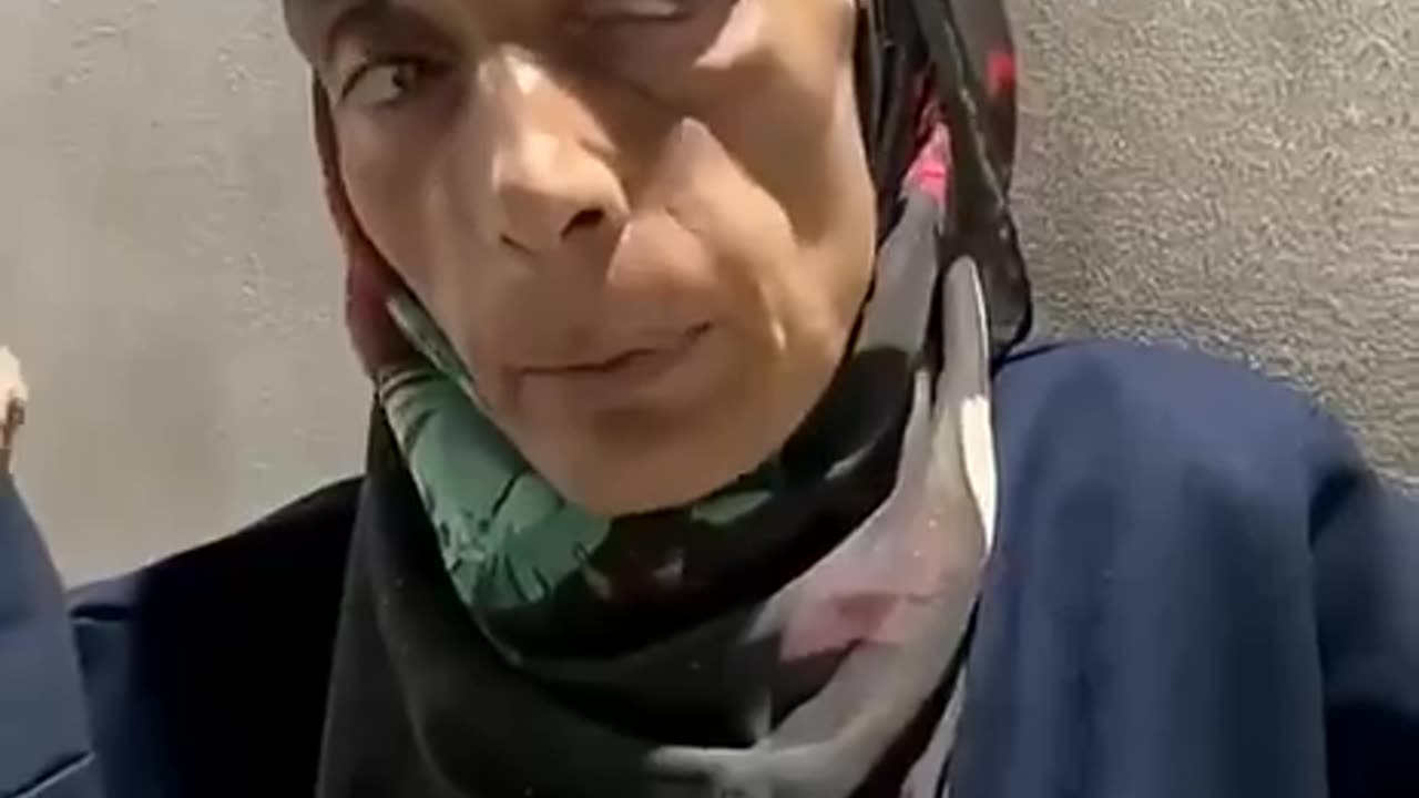 A displaced, starving Palestinian woman