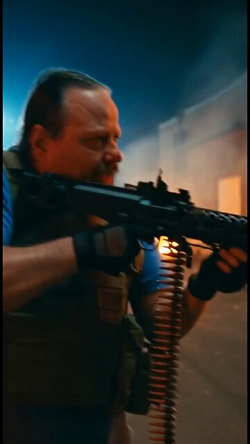 Russell Blade takes down a spiked alien with a machine gun.