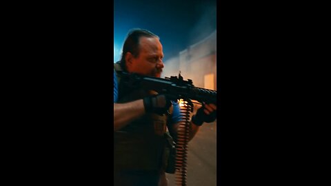 Russell Blade takes down a spiked alien with a machine gun.