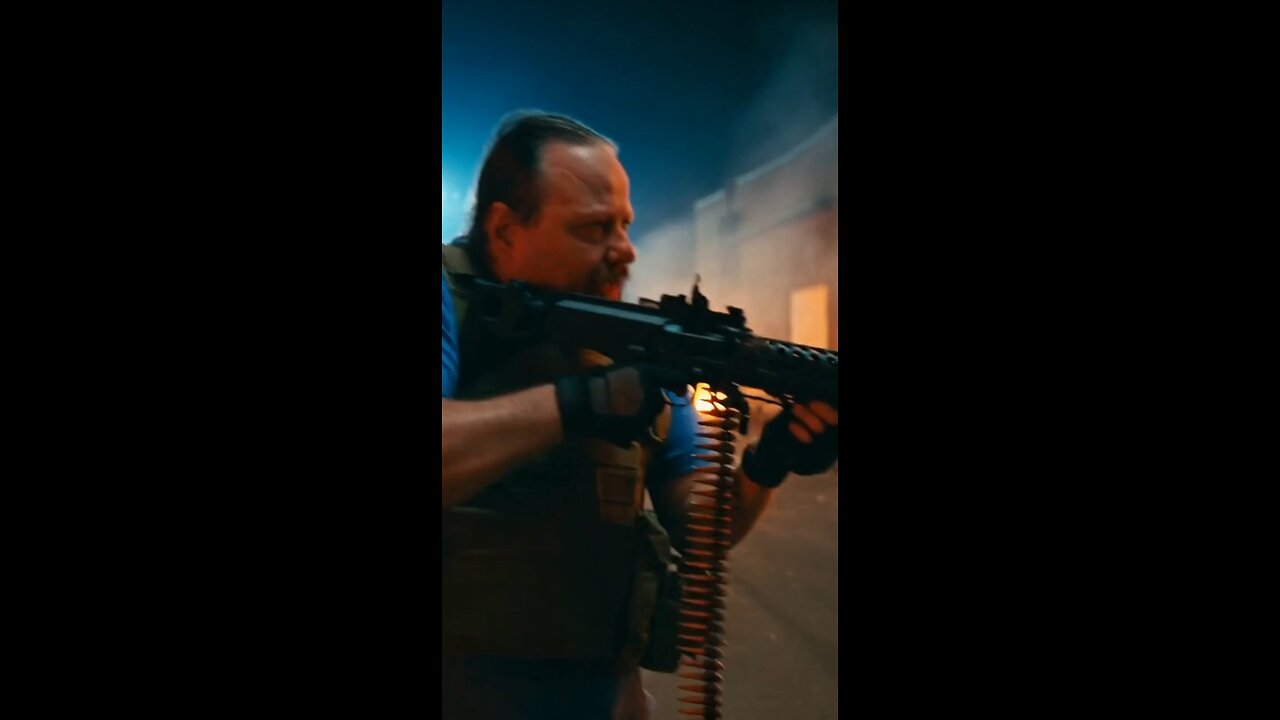 Russell Blade takes down a spiked alien with a machine gun.