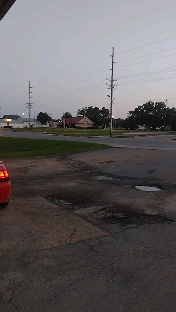 Ambulance leaving wreck on Hwy 425 passing by Mike's Place in Star City, Arkansas