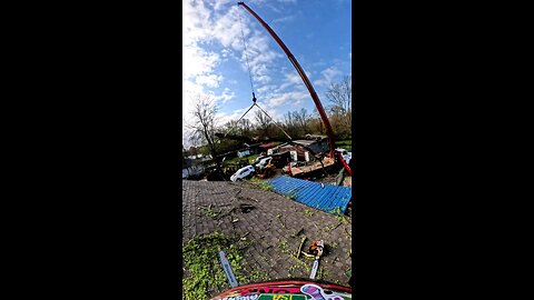 Crane Pulls Tree Limb Out of Tornado-Damaged House