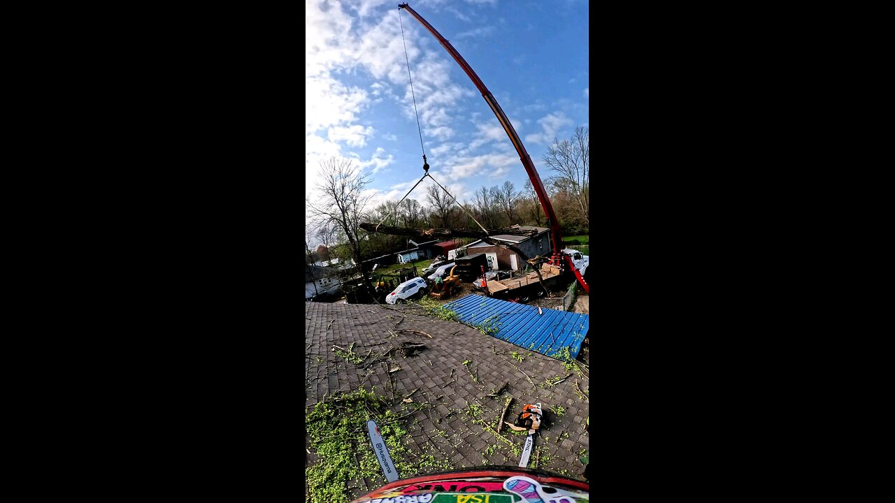 Crane Pulls Tree Limb Out of Tornado-Damaged House