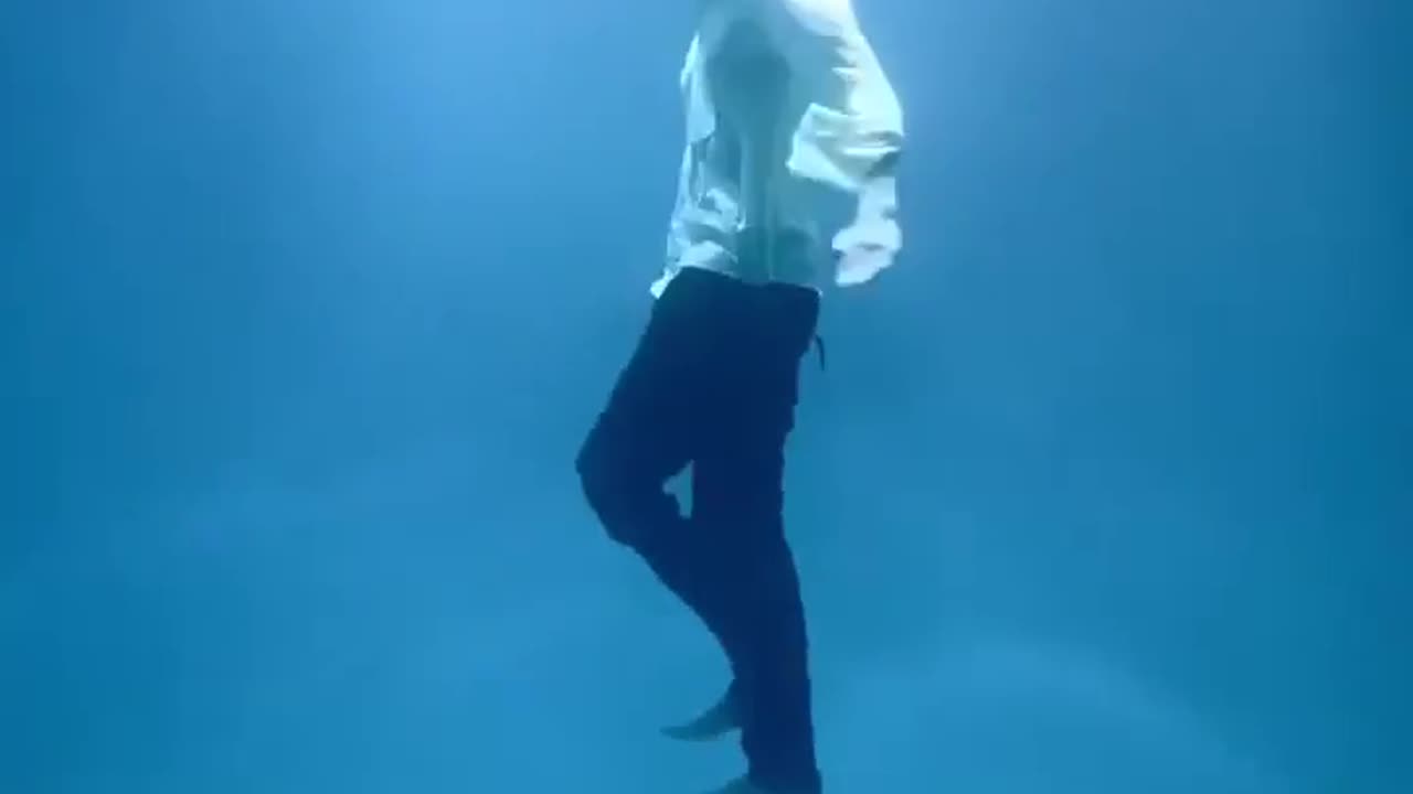Indian man performs an underwater pendulum