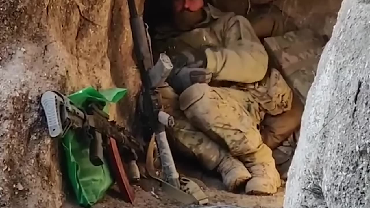 Ukrainian soldiers barely avoid Russian bomb as they hide in a trench