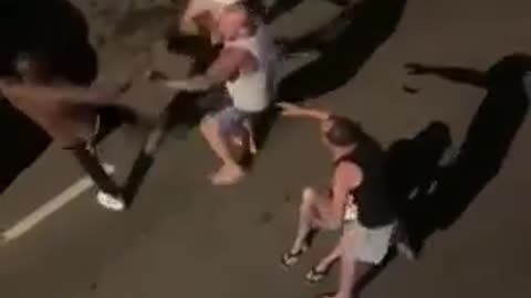 Hispanics beat the black off this negro for hitting a woman