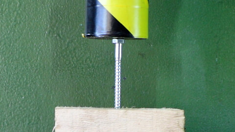 Hydraulic Press Crushing Bolt In Wood