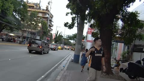 Trailing The Lady Along United Nations Avenue in Manila City in the Philippines