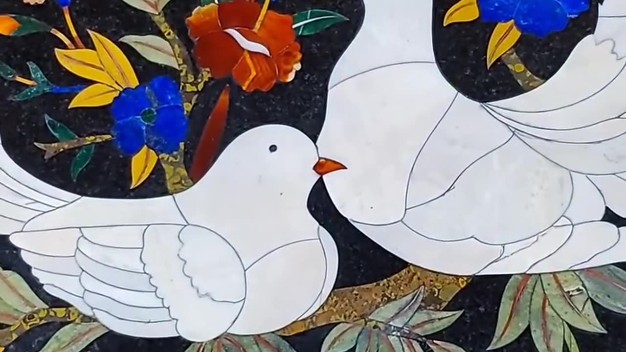 Inlaid pigeons in black marble with white marble